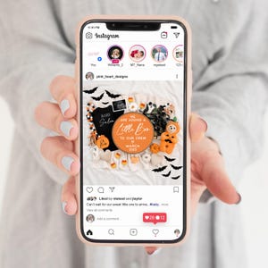 May include: A Halloween-themed baby announcement with a round wooden sign that reads "We are adding a little boo to our crew March 2025". The sign is surrounded by Halloween decorations, including bats, pumpkins, and a ghost.