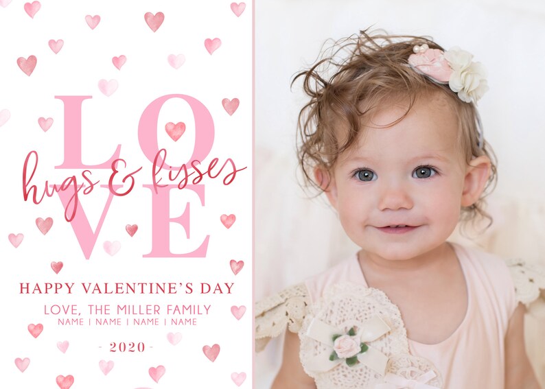 May include: A pink and white Valentine's Day card featuring a photo of a baby girl with curly hair wearing a pink dress and a flower headband. The card reads "LOVE hugs & kisses" in pink lettering with a pink heart. The card also says "HAPPY VALENTINE'S DAY LOVE, THE MILLER FAMILY NAME I NAME I NAME I NAME 2020-."