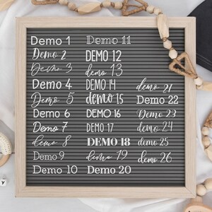 May include: A gray letter board with white letters spelling out "Demo 1" through "Demo 26" in a variety of fonts and capitalization.