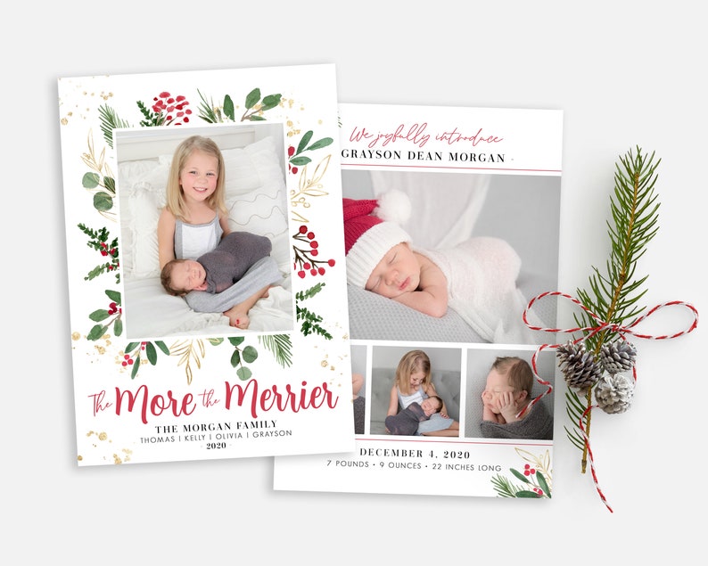 May include: Christmas-themed birth announcement card with a watercolor wreath of greenery, berries, and gold glitter. The card features a photo of a baby and a sibling, and the text "The More the Merrier" with the family name and birth date.