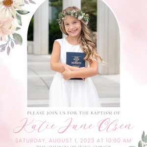 May include: A baptism invitation with a floral border and a photo of a young girl holding a copy of the Book of Mormon. The invitation includes the text "Please join us for the baptism of Katie Jane Olsen, Saturday, August 1, 2023 at 10:00 AM, The Church of Jesus Christ of Latter-day Saints, 125 North 100 West | Farmington, Refreshments to follow the baptism."