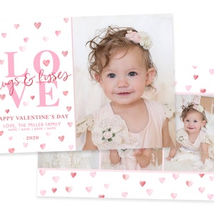 May include: A pink and white Valentine's Day card with a watercolour heart pattern. The card features a large pink "LOVE" with the words "hugs & kisses" in pink script. The text "HAPPY VALENTINE'S DAY" is below the LOVE. The text "LOVE, THE MILLER FAMILY" is below that. The text "NAME I NAME I NAME I NAME" is below that. The text "2020" is below that. The card has a photo of a baby girl in a pink dress with a flower crown on her head.
