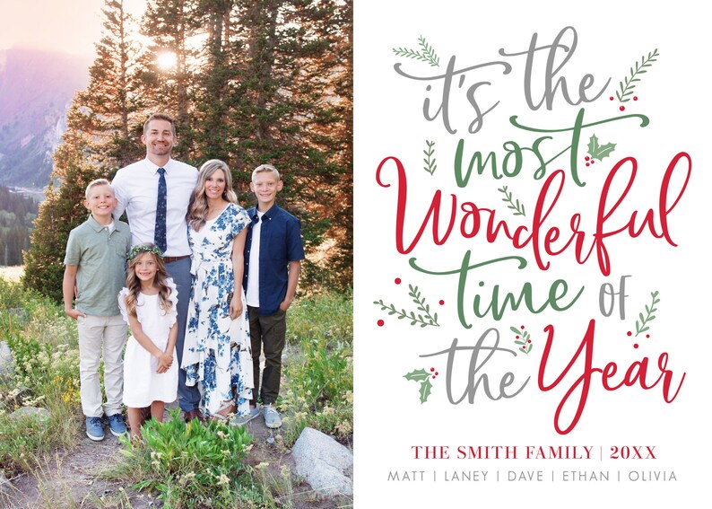 May include: A Christmas card featuring a family of five standing in front of a mountain range. The text on the card reads "It's the most Wonderful time of the Year." The family's last name is Smith.