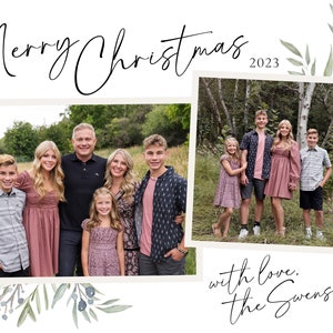 May include: A Christmas card featuring a family of seven posing in a green field. The card has a white background with green foliage and blue berries. The text "Merry Christmas 2023" is at the top of the card. The text "with love, the Svenssons" is at the bottom of the card.