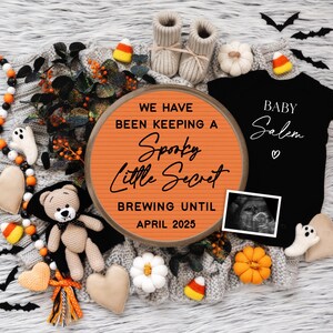May include: A Halloween-themed pregnancy announcement with a letter board that reads "We have been keeping a Spooky Little Secret Brewing Until April 2025". There is a black onesie with the text "Baby Salem" and a sonogram image.