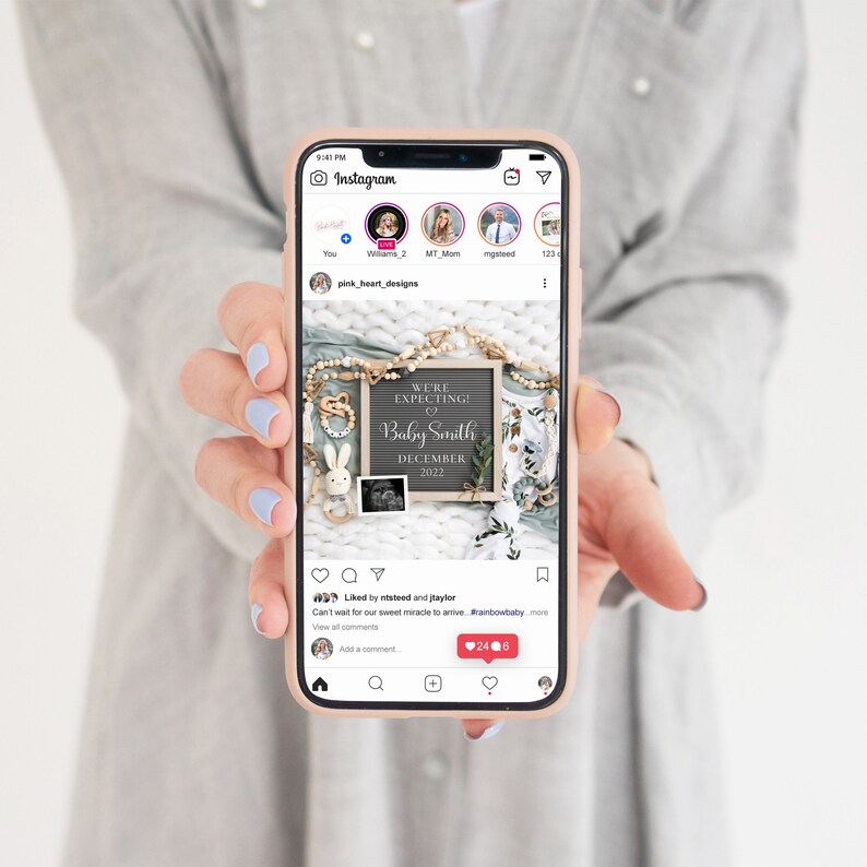 May include: A smartphone screen displaying an Instagram post announcing a pregnancy with the text "We're expecting a Baby Smith December 2022". The post includes a photo of a chalkboard sign with the announcement, a baby onesie, and a wooden bunny rattle.
