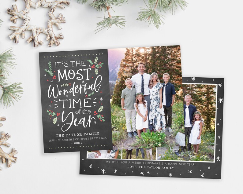 May include: A Christmas card with a chalkboard background featuring the text "It's the Most Wonderful Time of the Year." The card also includes a photo of a family standing in a forest setting. The text "The Taylor Family" and the year "2021" are also included on the card.