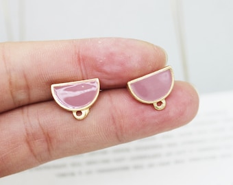 May include: Two gold-toned, semi-circle shaped earring charms with a mauve enamel fill. Each charm has a small loop at the bottom for attaching to earring hooks or other jewelry findings. The charms are displayed on a light background.