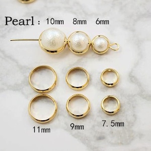 May include: A set of gold-colored jump rings in various sizes, ranging from 6 mm to 11 mm. The jump rings are arranged in a row on a white marble surface. The text "Pearl: 10mm 8mm 6mm" is visible above the jump rings. Below the jump rings, the sizes are labeled in millimeters: 11mm, 9mm, 7.5mm.