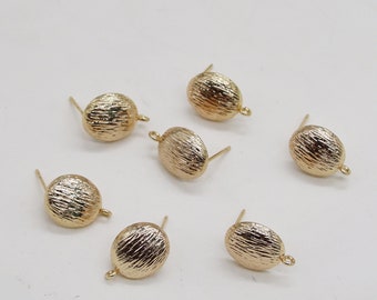May include: Six gold-toned earring findings with a textured, rounded top and a post for attaching earrings.