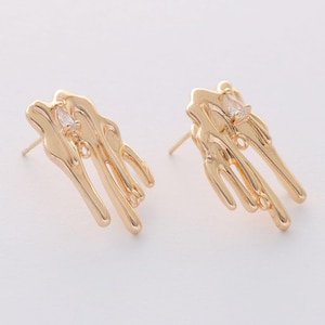 May include: A pair of gold-tone earrings with a unique abstract design. Each earring features a clear crystal stone.