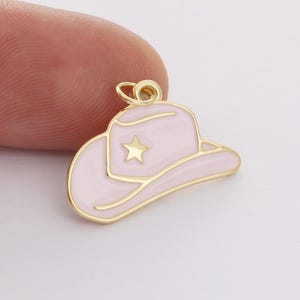 May include: Gold-tone charm in the shape of a pink cowboy hat with a gold star on the crown.