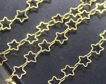 May include: Gold star-shaped chain links. The chain is made of metal and has a shiny finish.