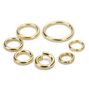 May include: Assortment of gold jump rings in various sizes. These rings are perfect for jewelry making, crafting, and DIY projects.