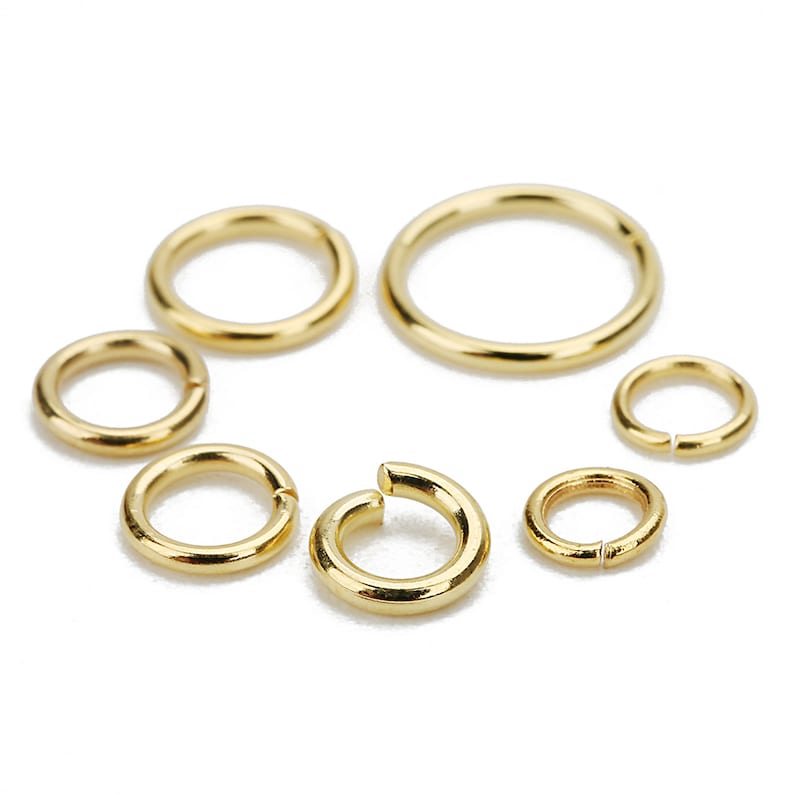 May include: Assortment of gold jump rings in various sizes. These rings are perfect for jewelry making, crafting, and DIY projects.