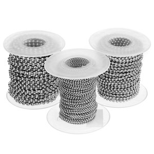 May include: Three spools of silver ball chain, each wound around a clear plastic spool. The chain is made of small, round metal beads.