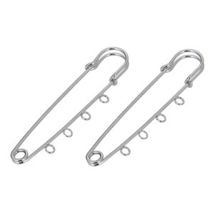 May include: Two silver safety pins with multiple loops on each pin.