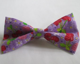 Nigel's Red Cherries with Bright Green Stems Tutti Frutti Bow Tie!  Colorful Flowers and designs of White, Yellow, and Pink on Purple.