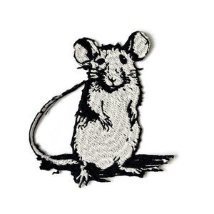 May include: Black and white embroidered iron-on patch of a mouse sitting up with its tail curled behind it.
