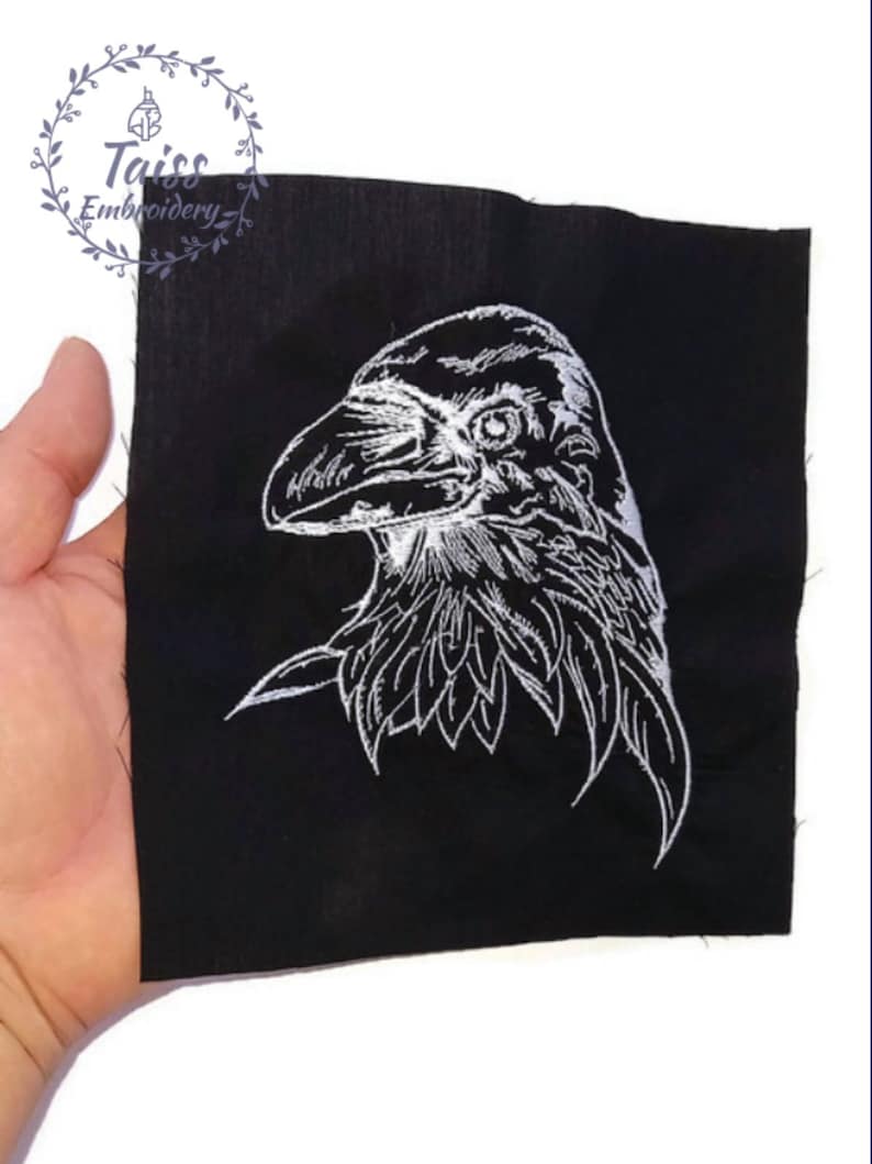 May include: White embroidered raven design on a black fabric patch.