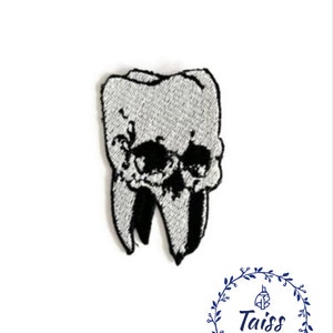 May include: An embroidered patch depicting a tooth with a skull design, in white.