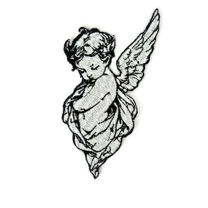 May include: A black and white embroidered iron-on patch of a cherub angel with wings.