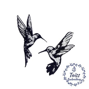 May include: Two black and white hummingbird silhouettes flying in opposite directions. The hummingbirds are facing each other with their beaks pointed towards each other.