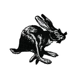 May include: Black and white embroidered patch of a rabbit running. The rabbit is facing the right side of the image.