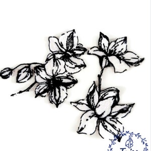 May include: Black and white embroidered floral patches. The patches feature detailed outlines of flowers and buds. The design includes a logo with the text "Taiss Embroidery".