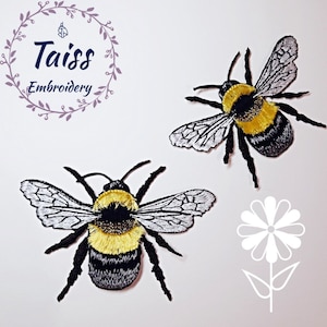 May include: Two embroidered bumble bee patches with black and yellow stripes, white wings, and black legs. The patches are on a white background.