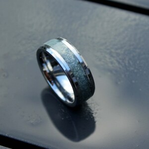 Aquamarine ring on tungsten ring