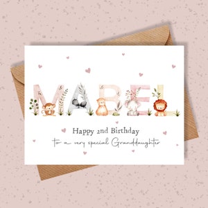 May include: A birthday card with the name Mabel spelled out in large letters with animals in each letter. The card says "Happy 2nd Birthday to a very special Granddaughter".