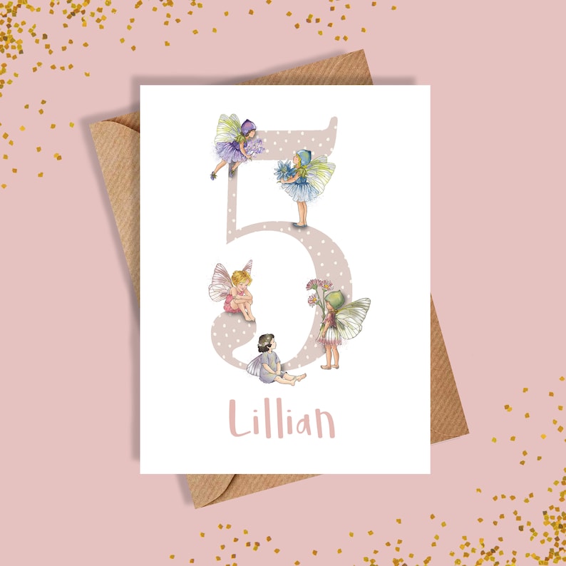 May include: A white card with a pink polka dot background featuring a large number 5 with four fairies surrounding it. The fairies are wearing pink, purple, and blue dresses with wings. The name Lillian is written below the number.