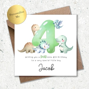 May include: A birthday card featuring a green number 4 with cartoon dinosaurs. The card includes the text "Wishing you a ROARsome 4th Birthday to a very special little boy" and a personalized name. A gold sticker says "Personalise Me".