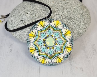 Dot mandala artwork in dot painting on natural wood pendant