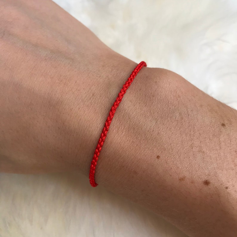 red string bracelet