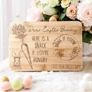 May include: A rectangular bamboo chopping board with engraved text and illustrations. The text reads "Dear Easter Bunny, Here is a snack if you're hungry, and a drink if you're thirsty." A carrot and bunny are also engraved.