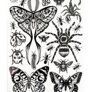 May include: A sheet of black and white temporary tattoos featuring various insects and arachnids, including a large moth, a spider, a scorpion, butterflies, ladybugs, bees, and ants. The text J IRIS Studio and ONYX03 are printed on the sheet.