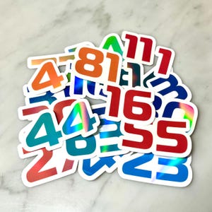 Jij kiest!! Sticker chauffeursnummer - teamkleuren!!! Line-up 2024: holografisch vinyl