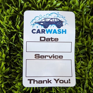May include: White car wash sticker with a blue and white car icon, the words "CARWASH", "Date", "Service", and "Thank You!"
