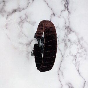 chocolate brown velvet padded headband photographed from above