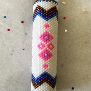 Hand beaded native designer keychains. Specialty design hand beaded keychains. SOLD SEPARATELY.