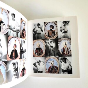 May include: A book page displaying a grid of black and white photographs featuring individuals in traditional attire, some framed in oval borders. The page includes the number 111 in the bottom right corner, showcasing various historical costumes.