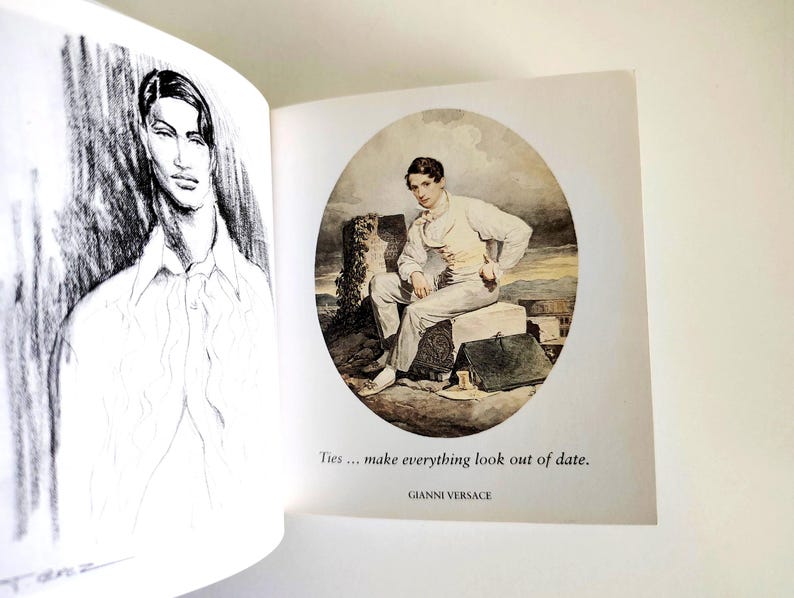 May include: A book page featuring a black and white charcoal sketch of a person on the left and a color illustration of a person sitting on a stone block on the right. The text reads: Ties ... make everything look out of date. GIANNI VERSACE.