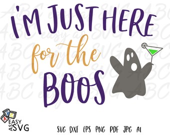 May include: A Halloween-themed graphic with the phrase "I'M JUST HERE for the BOOS" in purple and gold lettering. A gray ghost illustration holds a green cocktail. The image includes file type options: SVG, DXF, EPS, PNG, PDF, JPG, and AI.