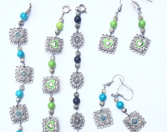 May include: Three silver bracelets with green and blue beads and square charms. Two pairs of silver earrings with green and blue beads and heart charms.