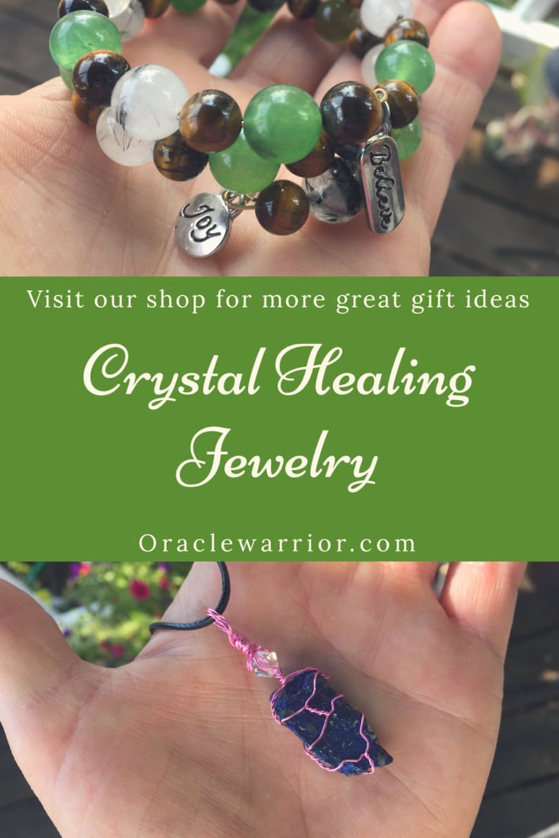 May include: Two crystal bracelets with green, brown, and white beads. The bracelets have charms that say "Believe" and "Joy". A necklace with a blue crystal pendant wrapped in pink wire.