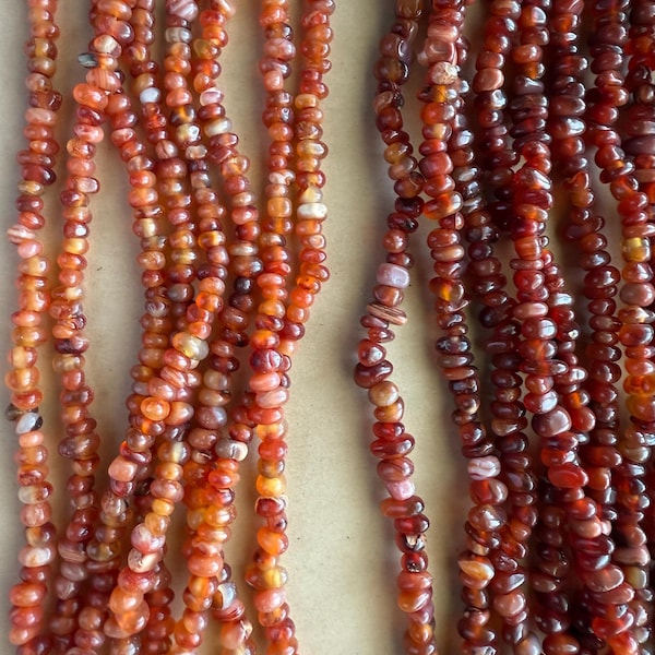 Natural Red-Orange Carnelian 8-10mm Smooth Chips Beads 16" Strand Orange Red Agate Gemstone Beads. ( These beads are graduated in size.)