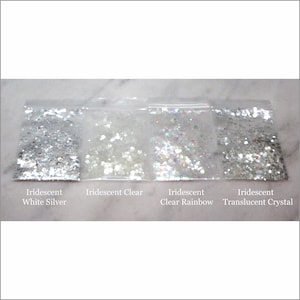 May include: Four small bags of iridescent glitter, labeled "Iridescent White Silver", "Iridescent Clear", "Iridescent Clear Rainbow", and "Iridescent Translucent Crystal".