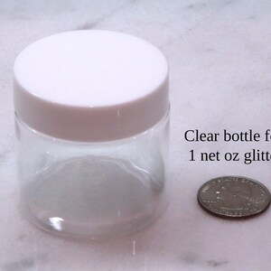 May include: Clear plastic bottle with a white lid, next to a US quarter, for 1 net oz glitter.